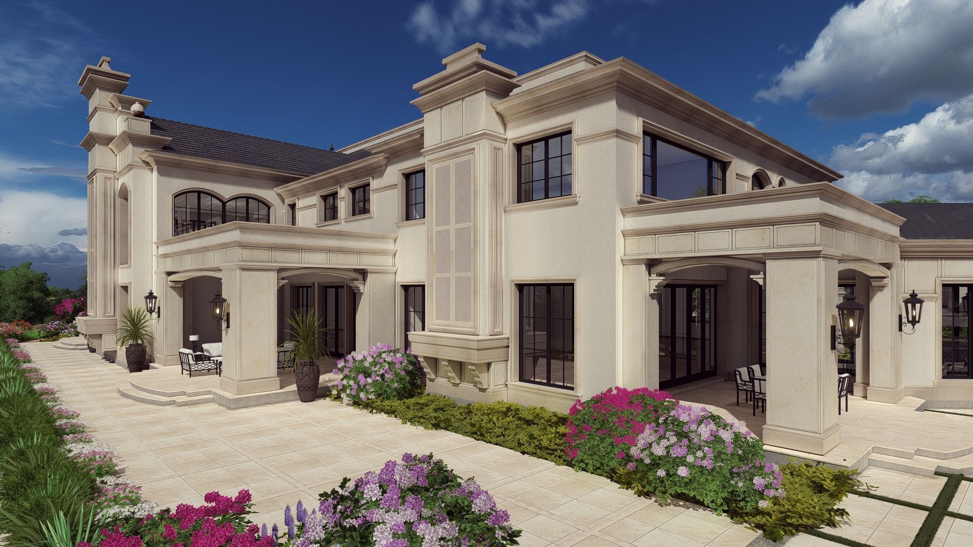 A large white house with a lot of windows and flowers in front of it.