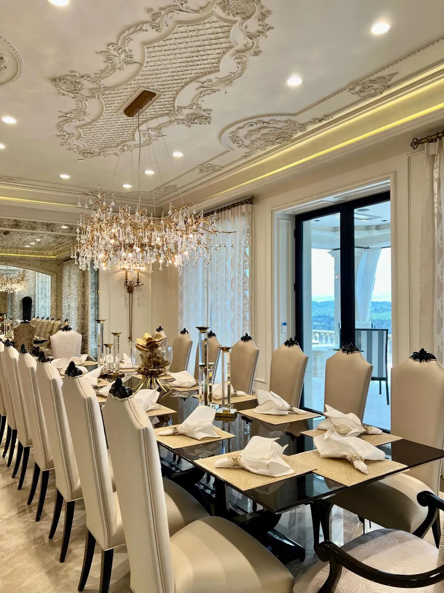 An aerial view of a large house with a pool in the backyard.