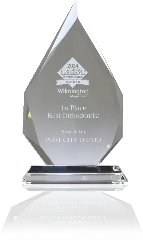 A crystal trophy that says