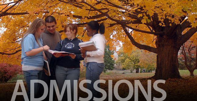 A group of people standing under a tree with the word admissions on the bottom