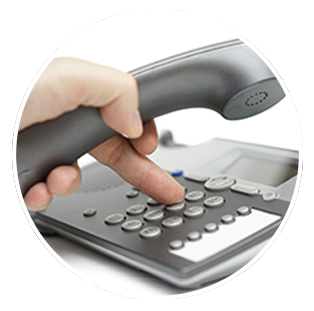 a person is pressing a button on a telephone .