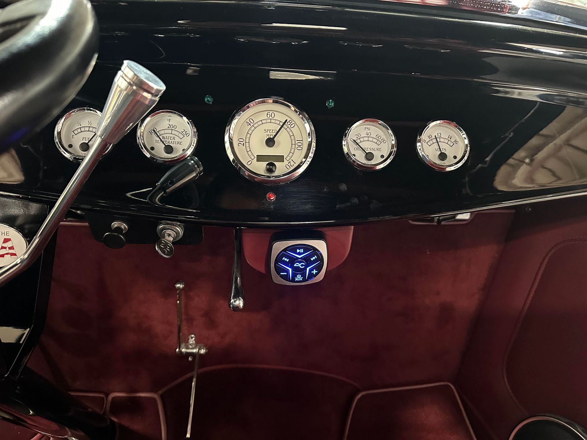 A dashboard of a car with a clock that says 1:24