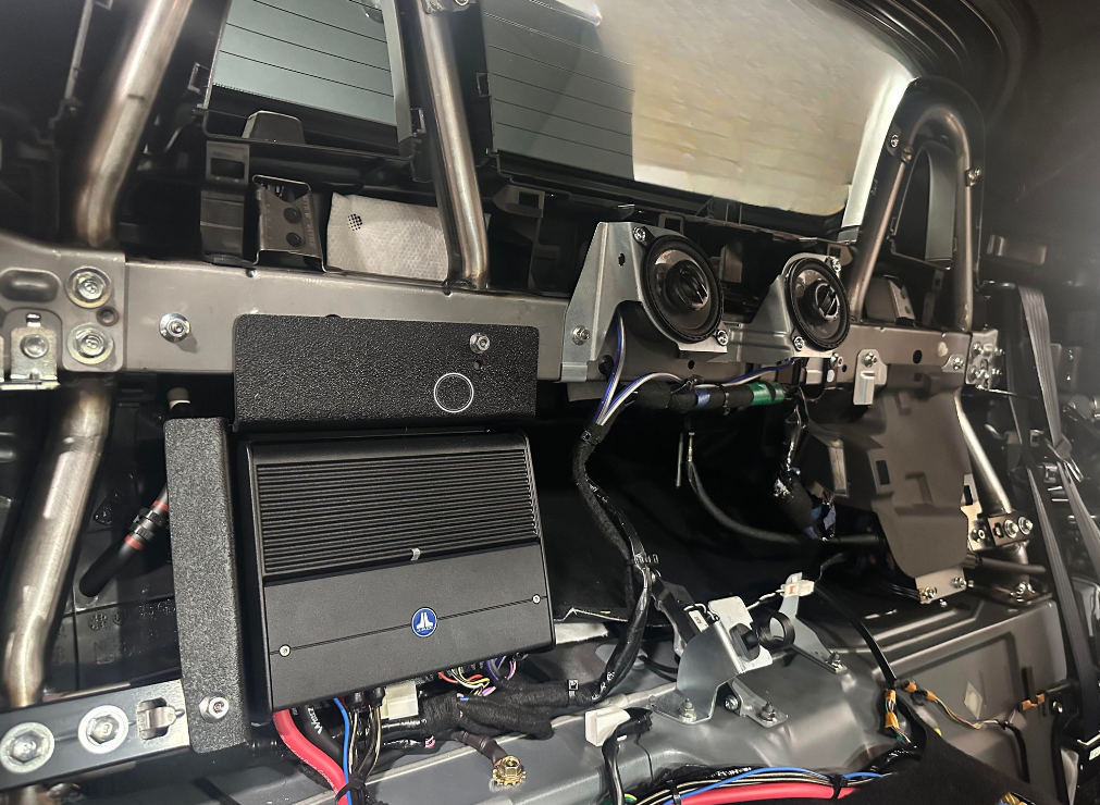 The inside of a car with a lot of wires coming out of it