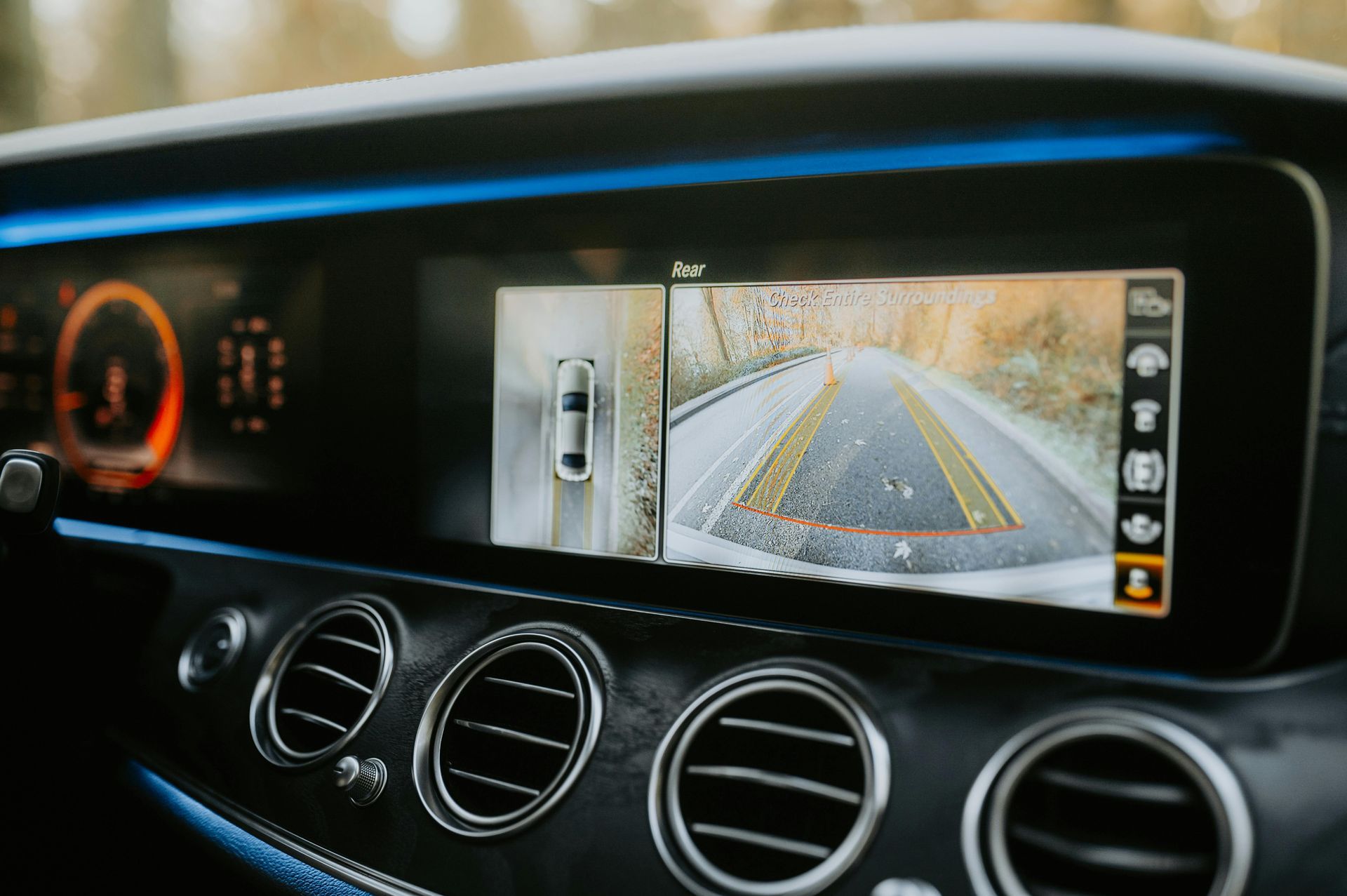 A close up of a car dashboard with a rear view camera.