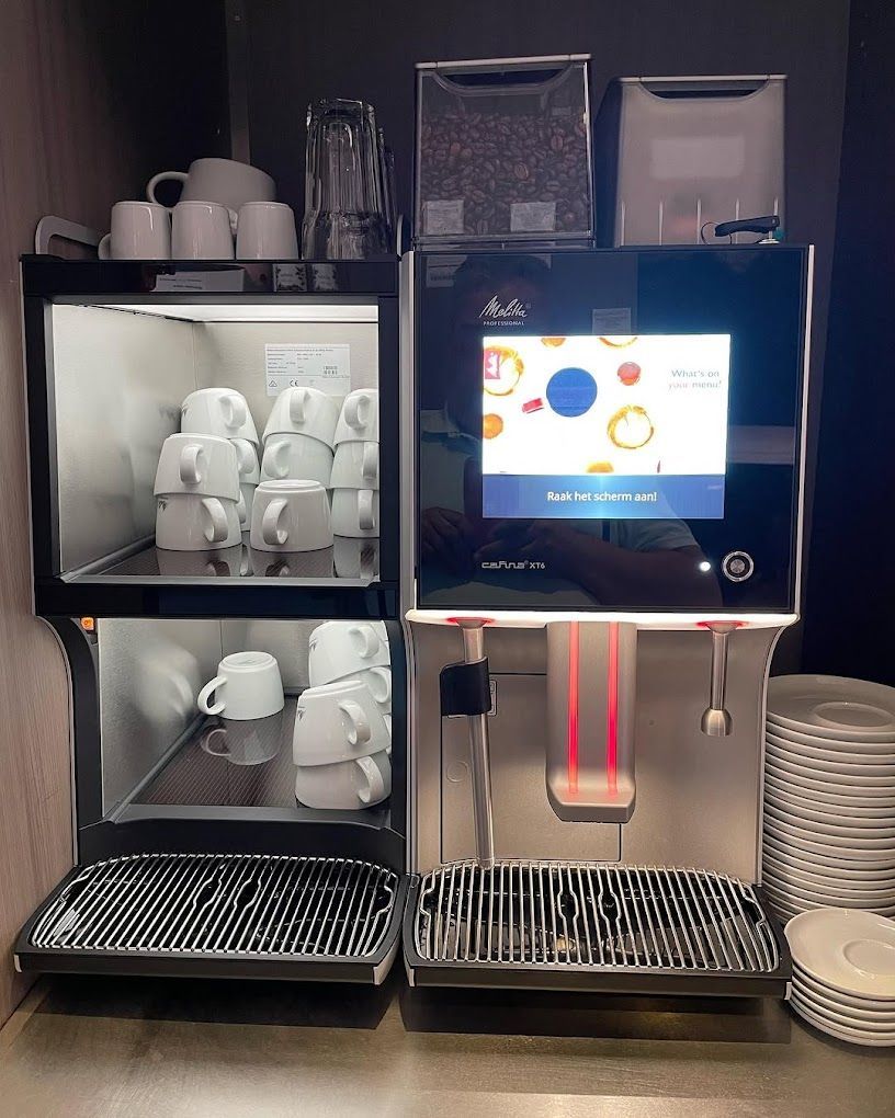 A coffee machine and a coffee maker are on a counter