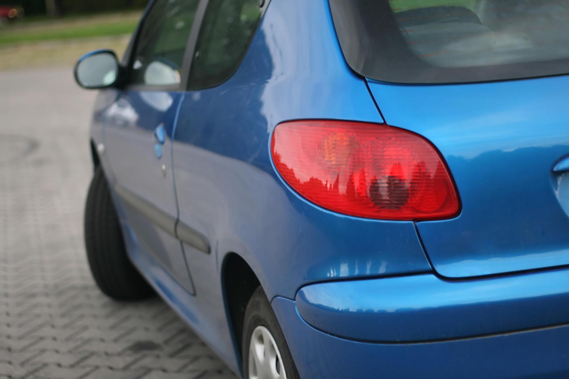 a tail part of the blue car