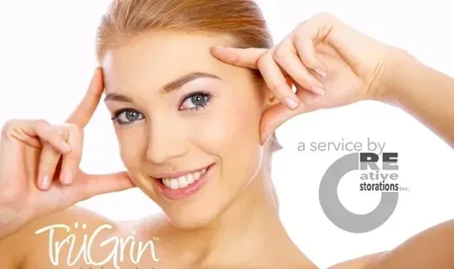 Woman smiling, holding fingers to temples, promoting TruGrin dental services.