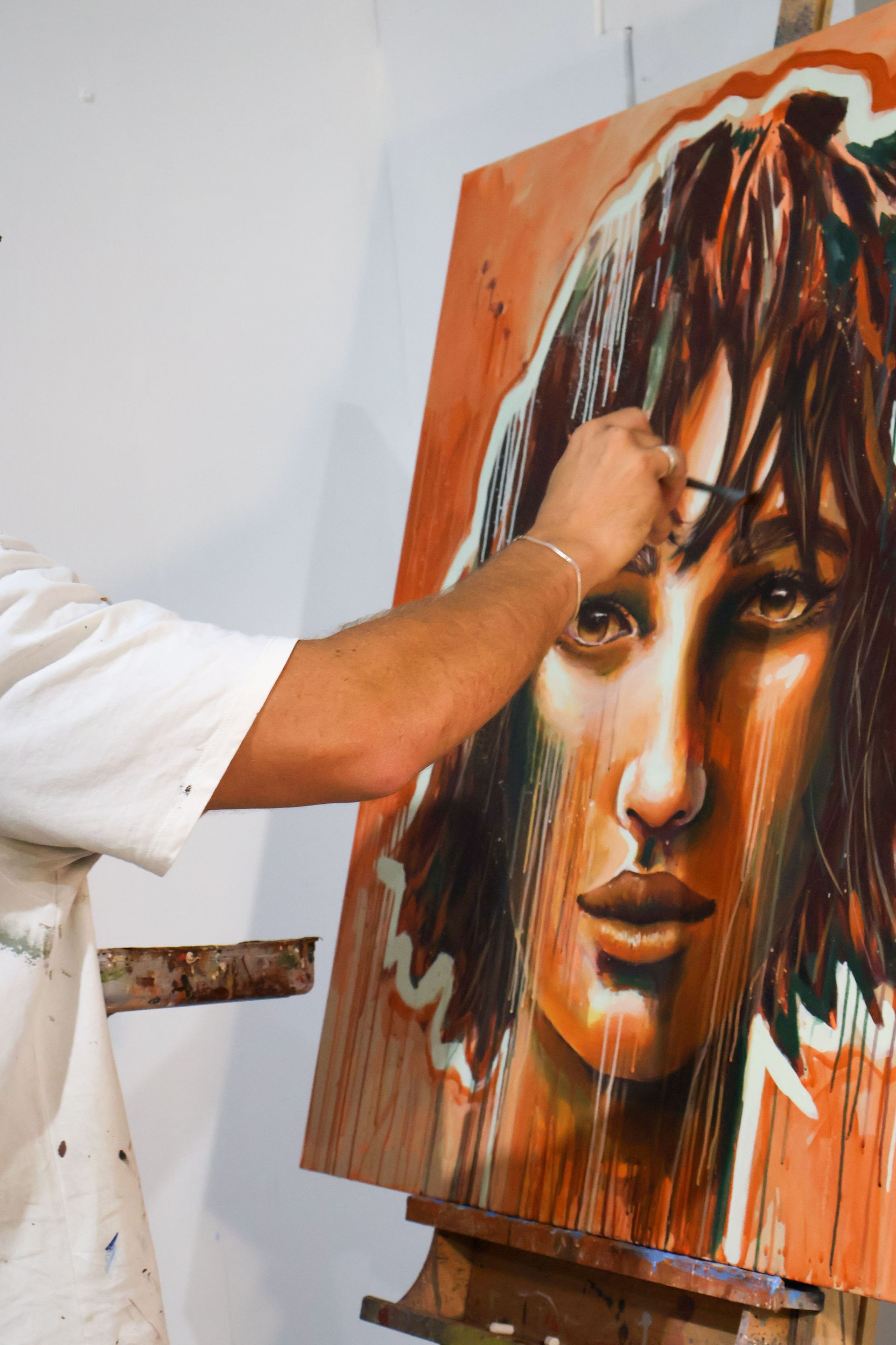 artist painting in their art studio for rent