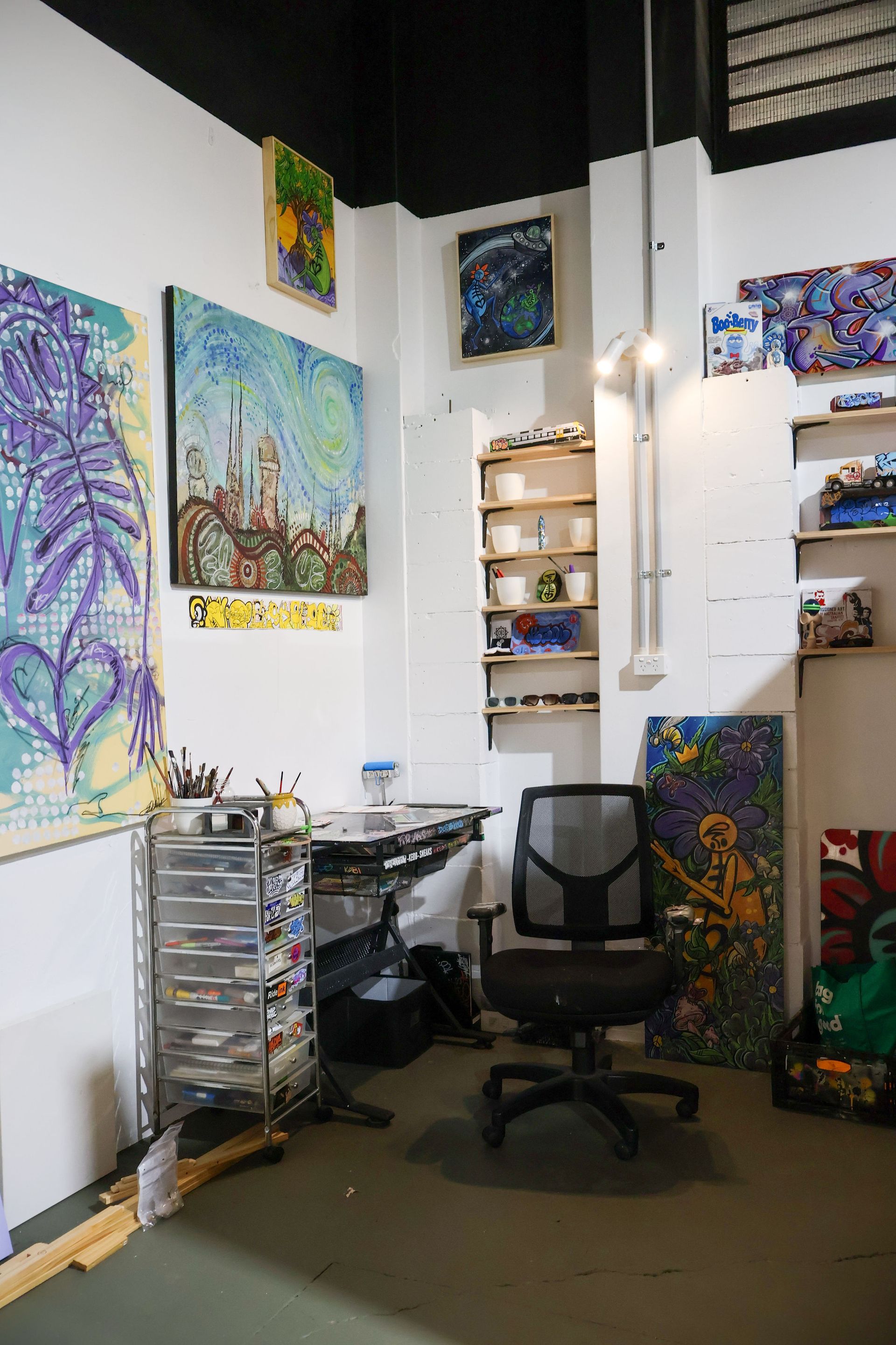 an artist studio for rent with paintings
