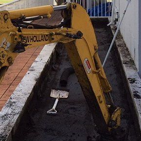 excavating hole with shovel