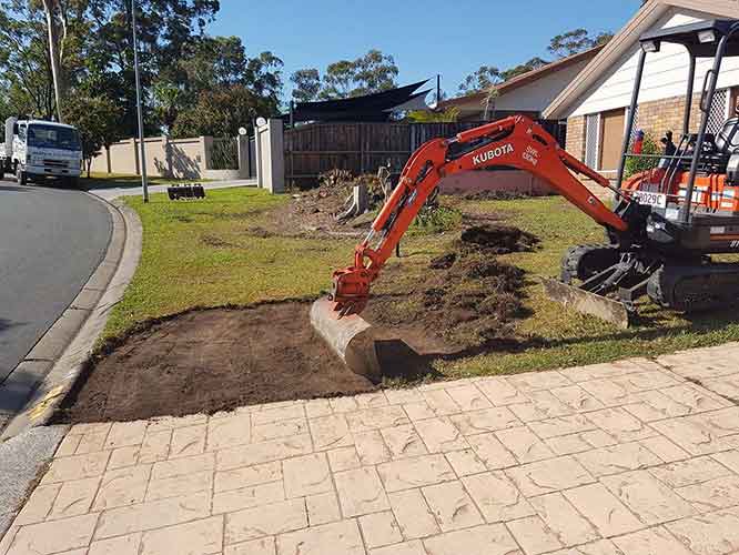 KUBOTA excavator removing the grass