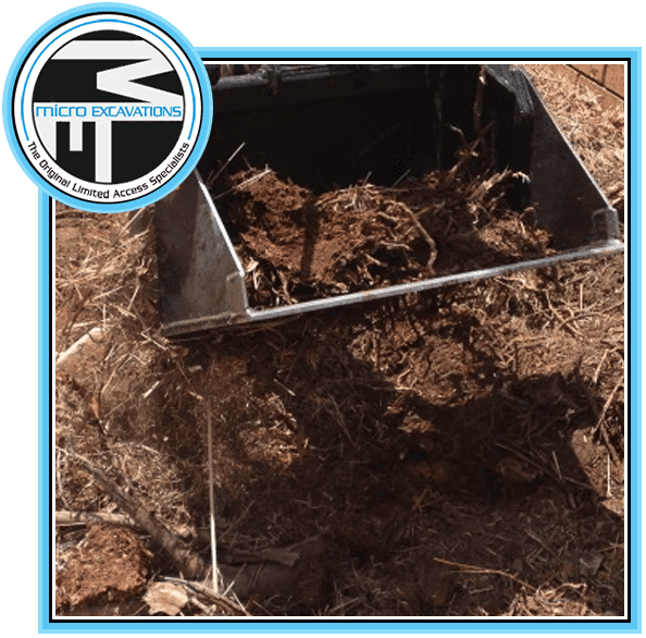 excavator pulling up soil