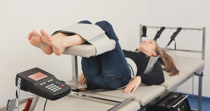 Woman Having Spinal Decompression Therapy