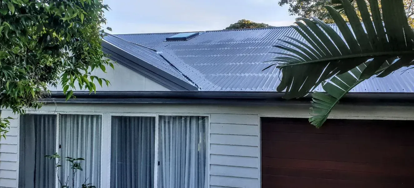 A Skylight is Open on the Roof of a House — Coast Metal Roof & Gutter In Morisset, NSW