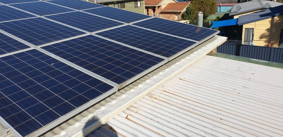 A Roof With a Lot of Solar Panels on It — Coast Metal Roof & Gutter In Tumbi Umbi, NSW