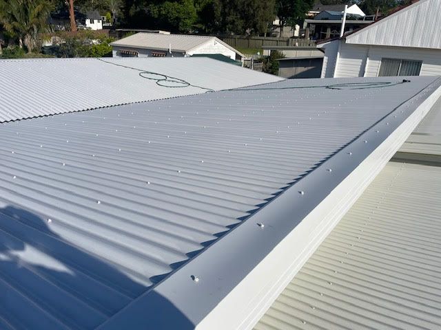 Looking Up at the Ceiling of a Large Warehouse — Coast Metal Roof & Gutter In Lake Macquarie, NSW