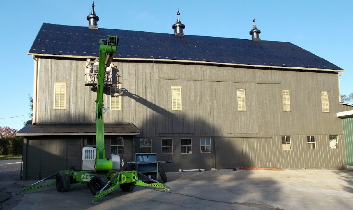 A Green Aerial Lift | Chambersburg, PA | Zeiset Painting and Exteriors