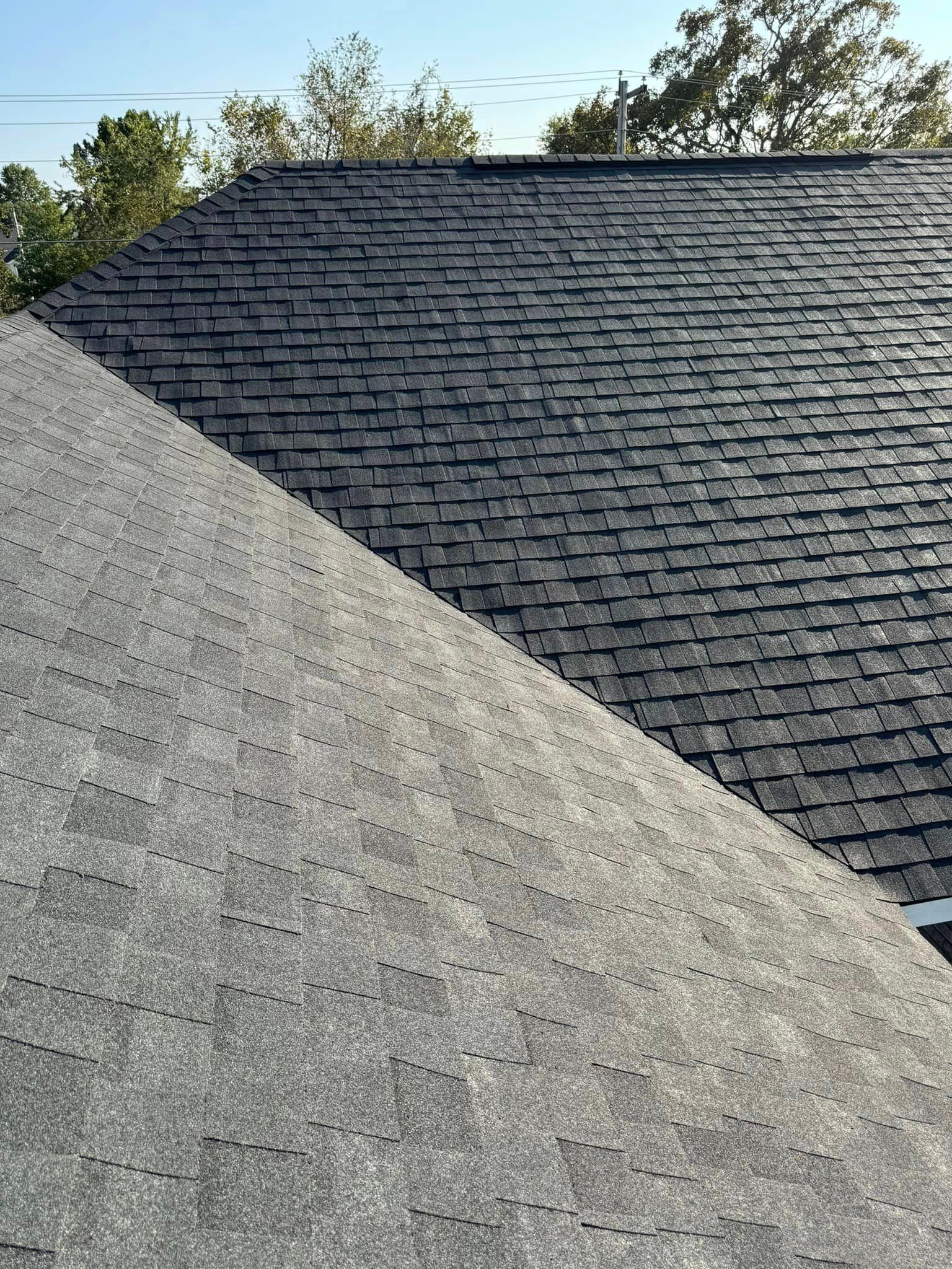 A close up of a roof with a lot of shingles on it.
