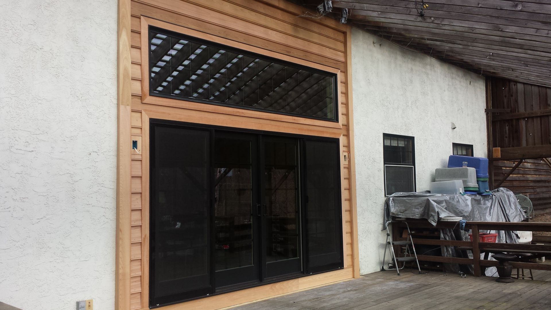 A pair of wooden sliding barn doors in a room.