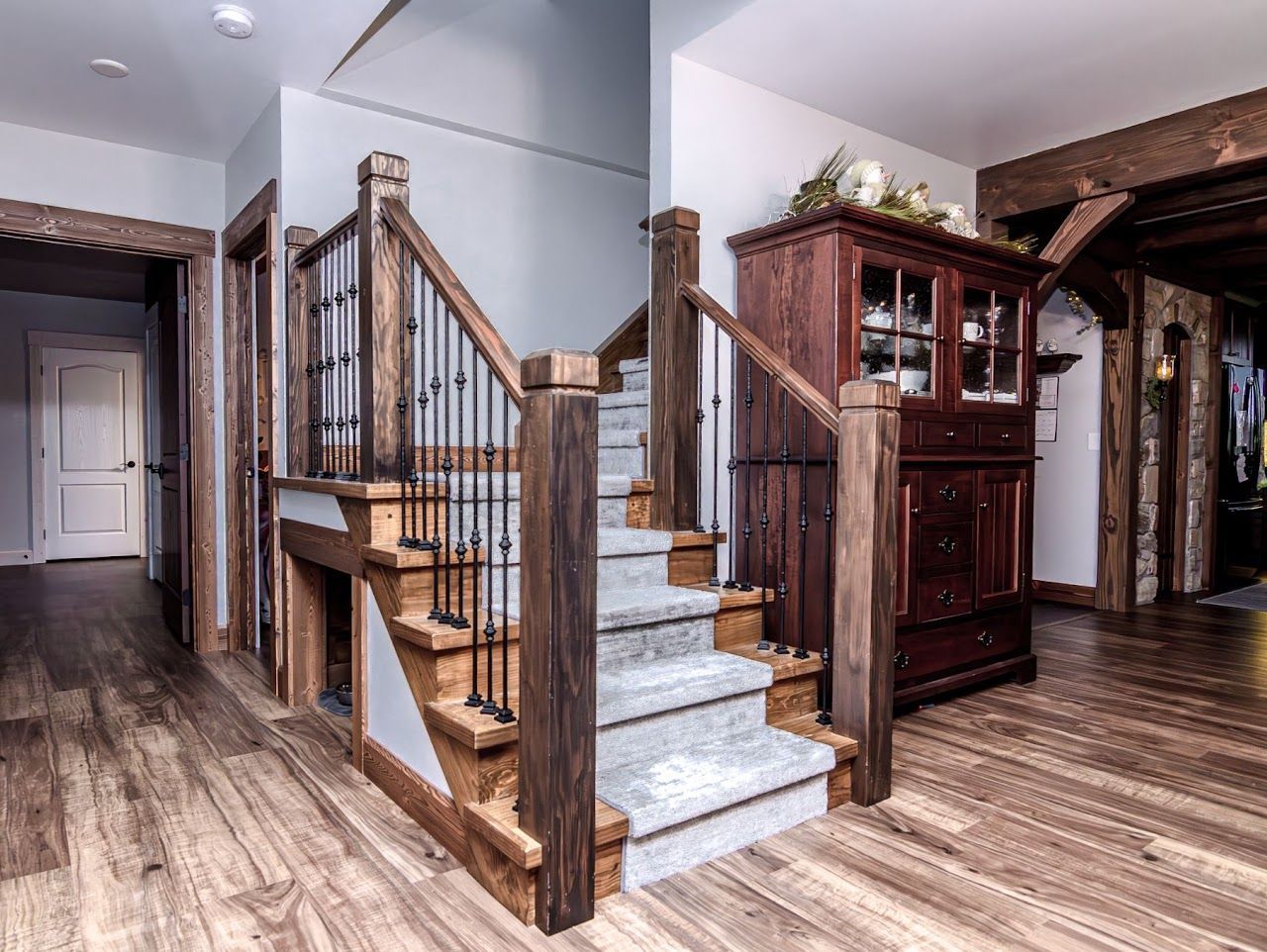 A living room with built-in shelves and a flat-screen TV.