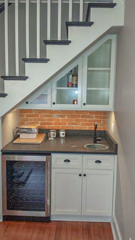 A living room with built-in shelves and a flat-screen TV.