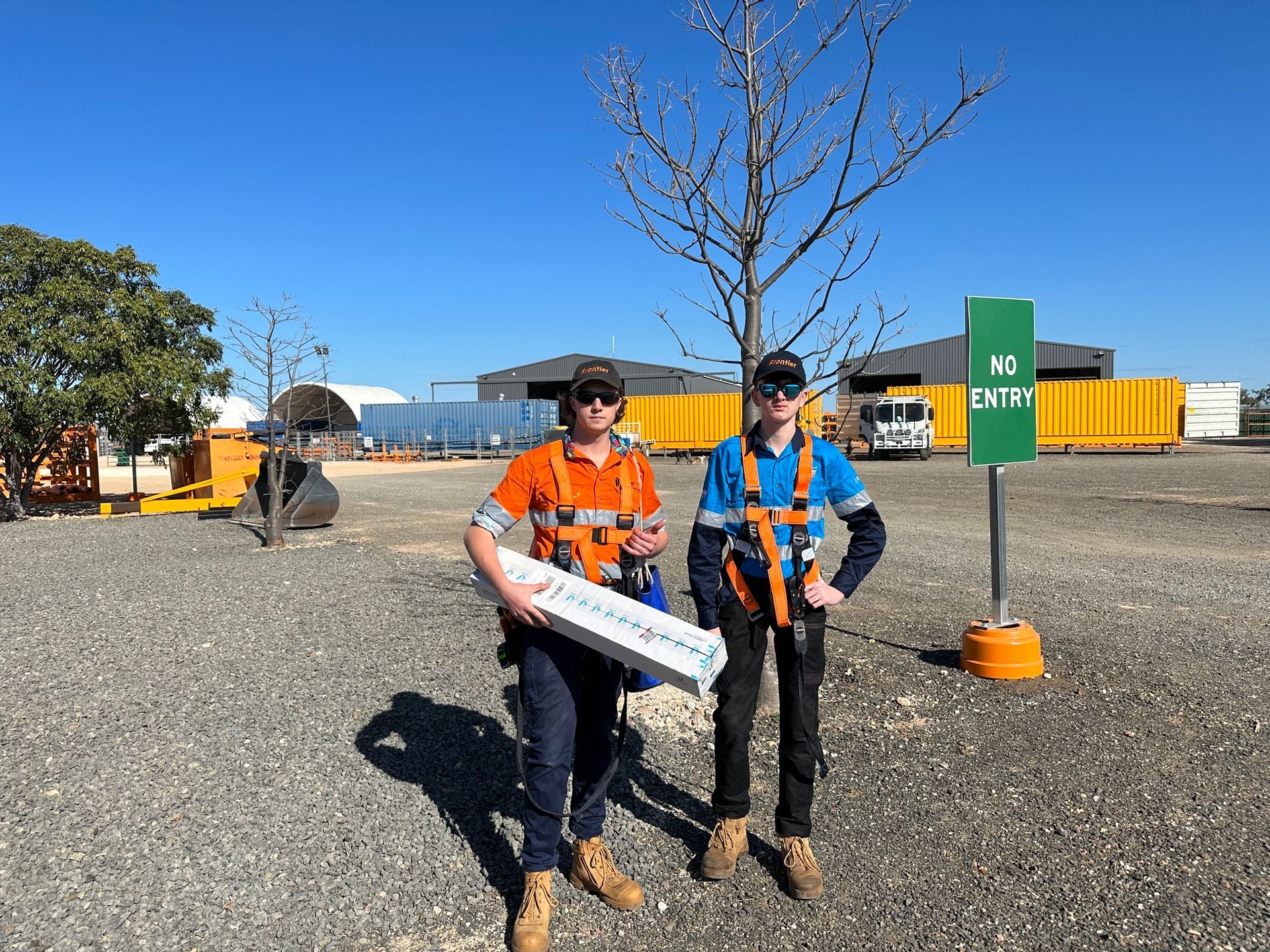 Two Data Cable Technicians Standing At A Commercial Property - Security Company in Toowoomba, QLD