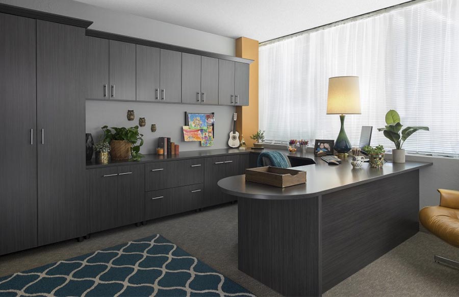 a licorice finish home office system with desk and cabinets