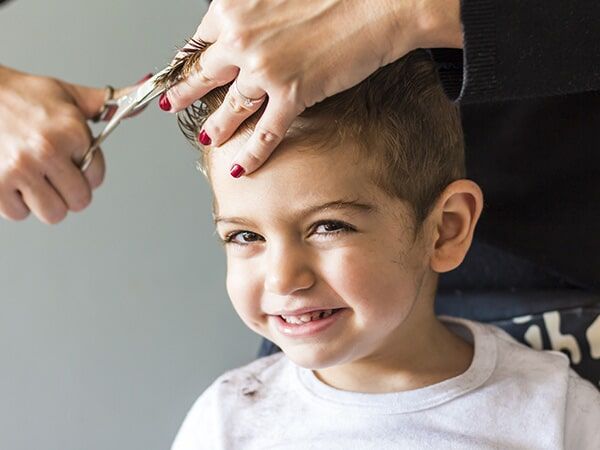 A Kid Is Getting A Haircut — KD's Hair Design In Soldiers Point, NSW