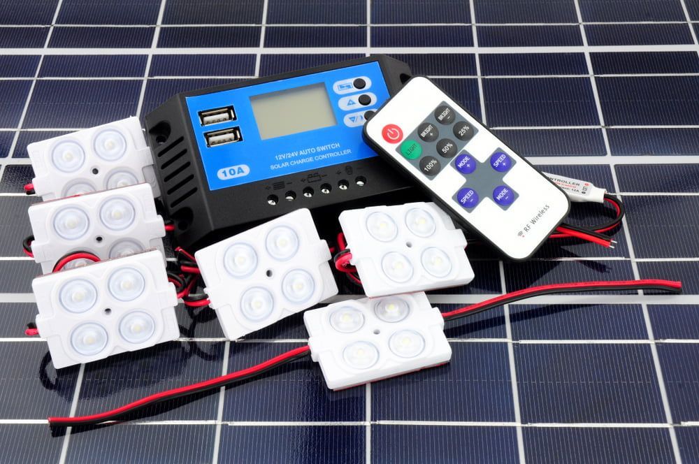 A Remote Control Is Sitting On Top Of A Solar Panel — Max Fox Electrical in Taminda, NSW
