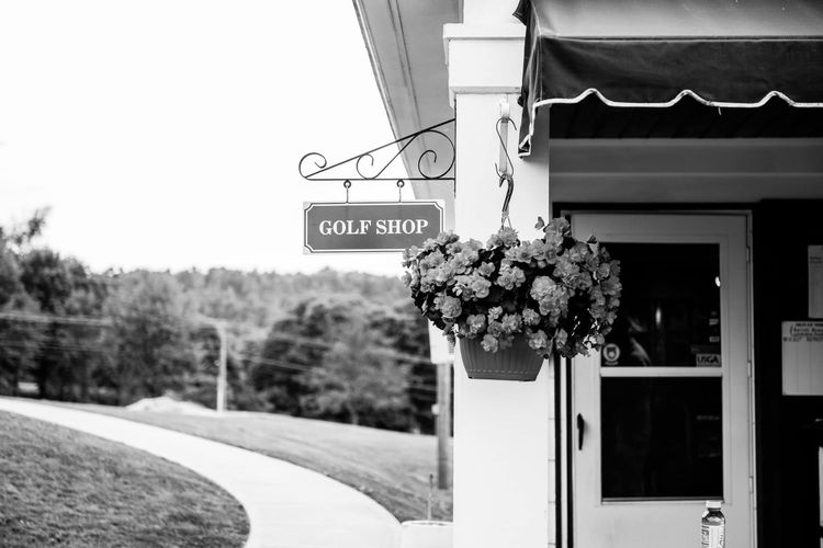 A black and white photo of a golf shop