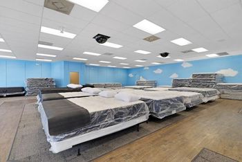 A store filled with lots of beds and mattresses