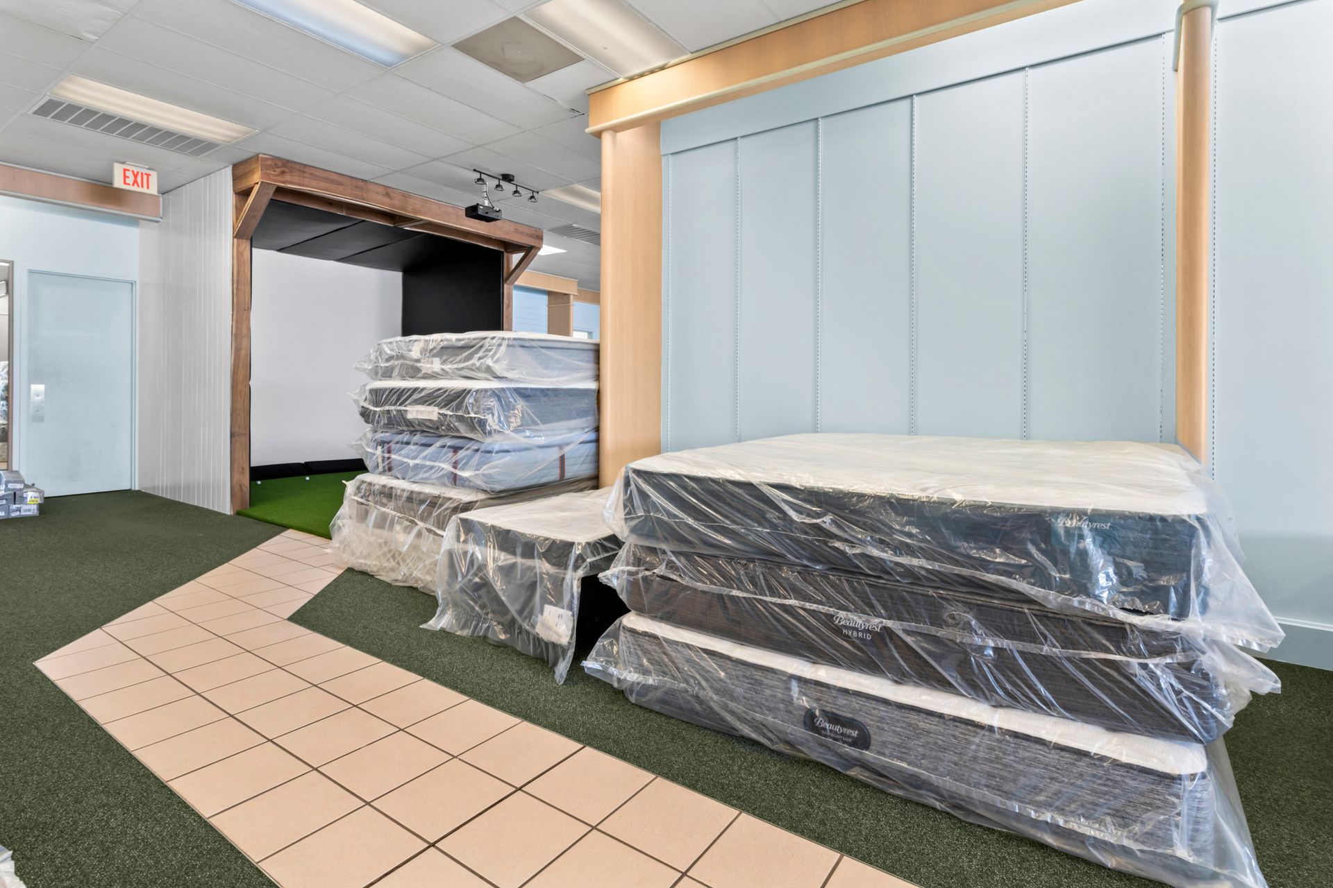 A store filled with lots of beds and mattresses A store filled with lots of beds and mattresses