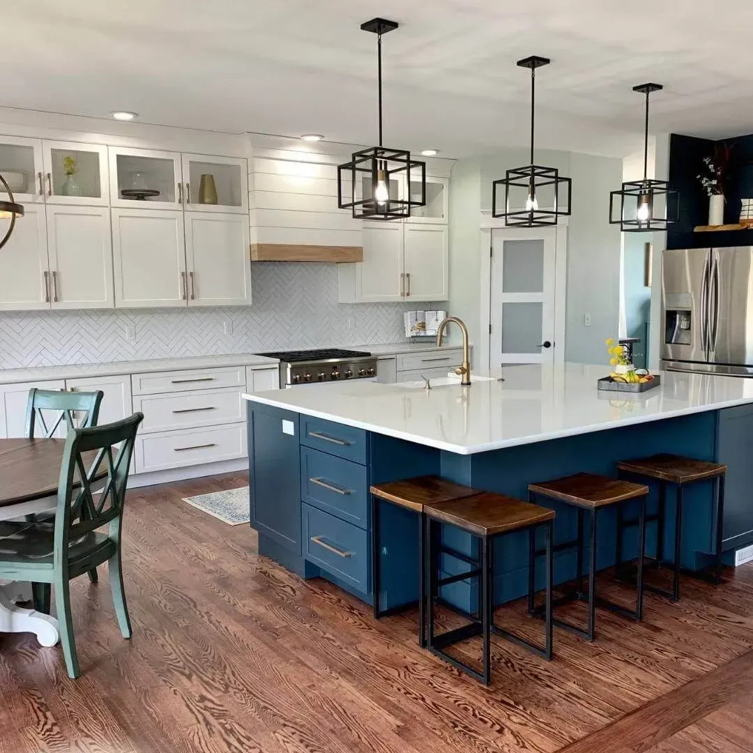 There is a large island in the middle of the kitchen.
