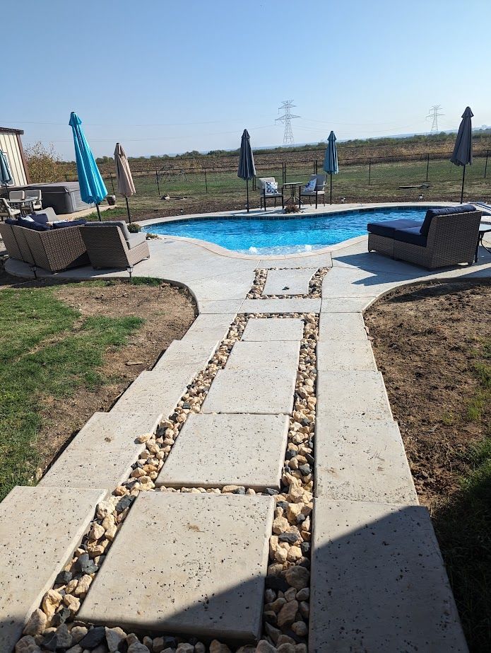A man is taking a sample of water from a swimming pool.