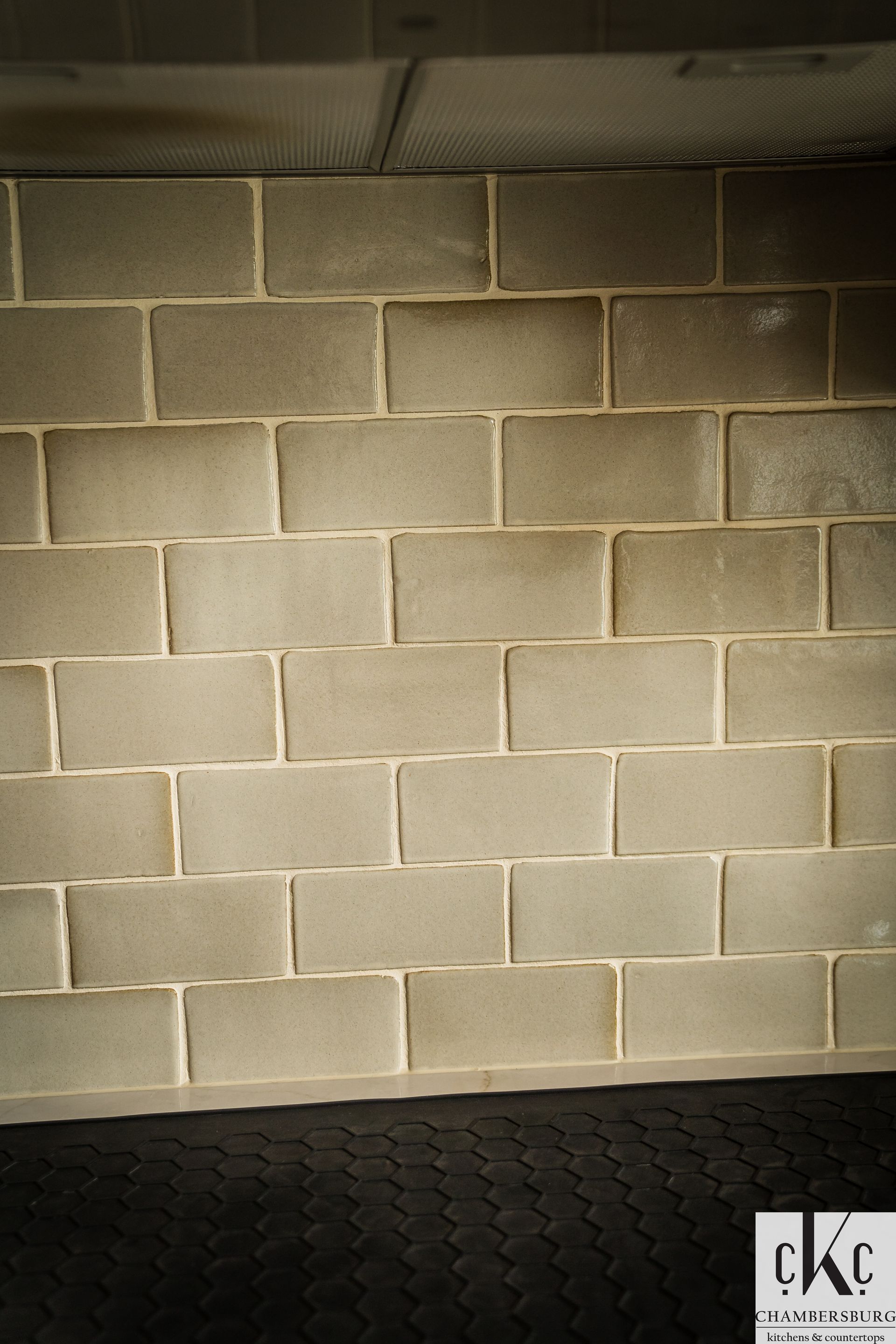 A brick wall with the letters ckc on it