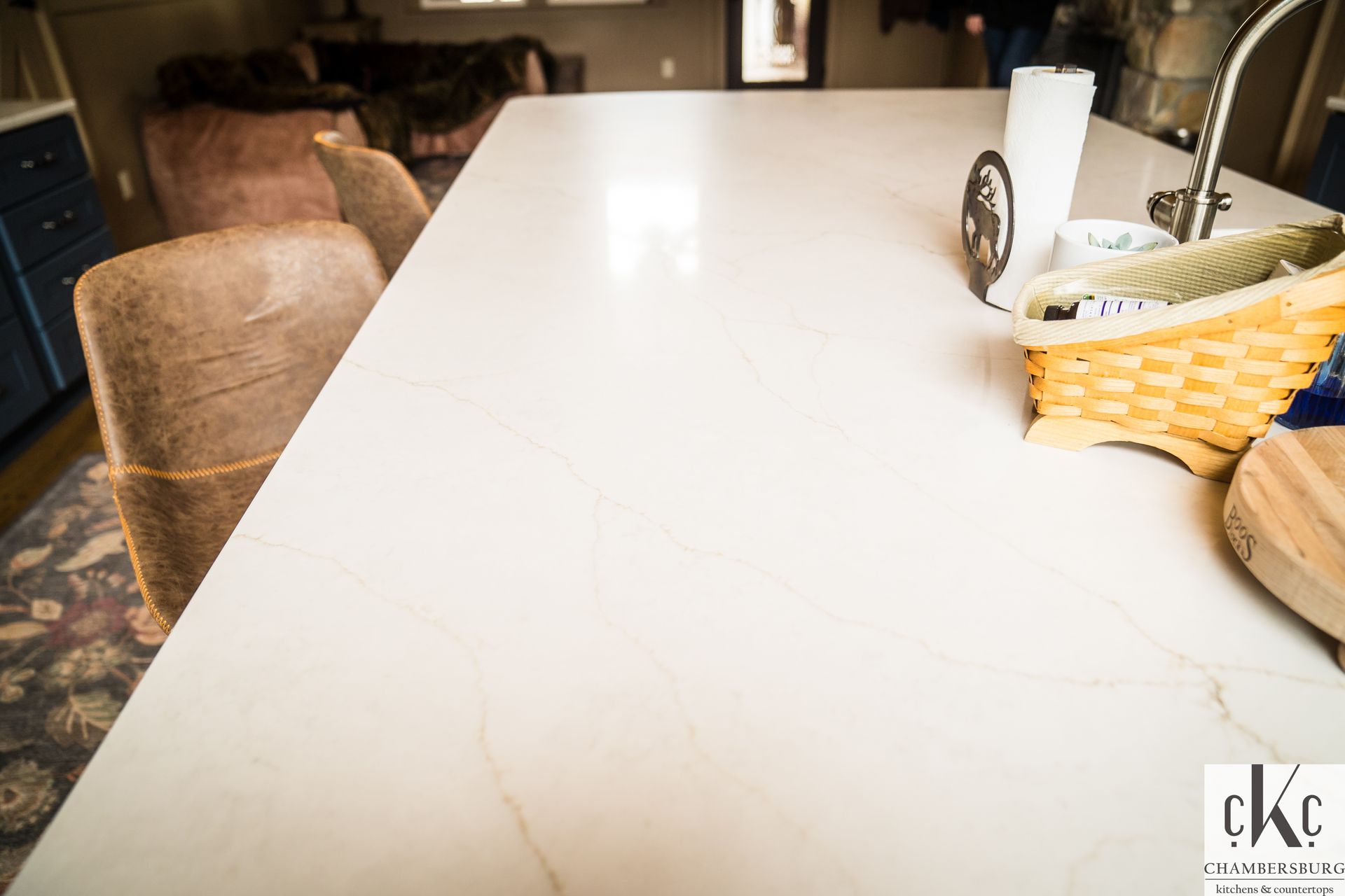 A white counter top with a basket on it in a kitchen.