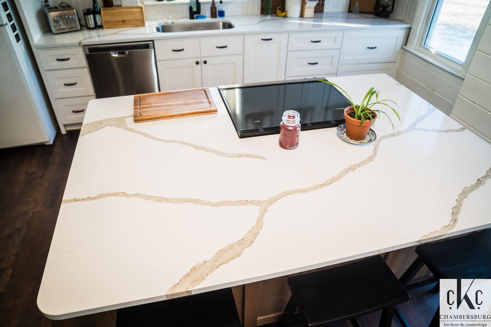 A man wearing a mask is breaking a wall with a hammer, Mont Alto, PA, Downin Building & Remodeling.