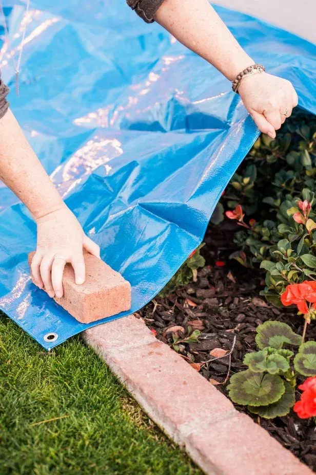 Before and after photo: rusted siding cleaned near air conditioner.