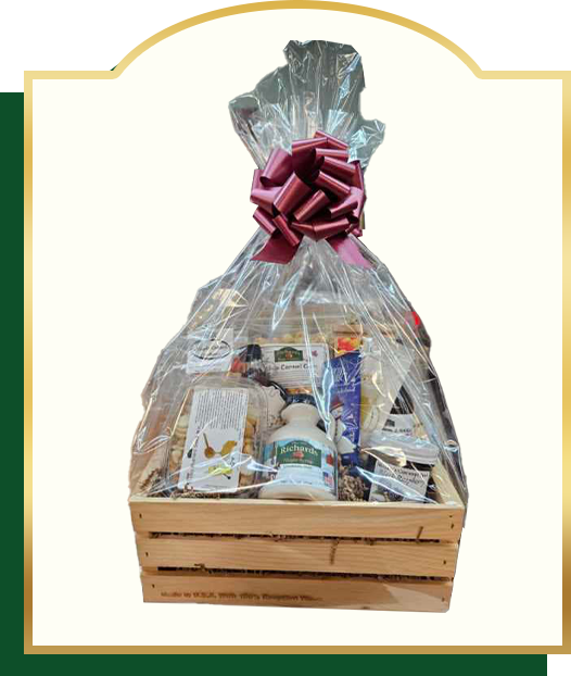 Gift basket in a wooden crate, wrapped in cellophane, tied with a burgundy bow.