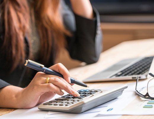 Woman accountant making calculations woman accountant making calculations