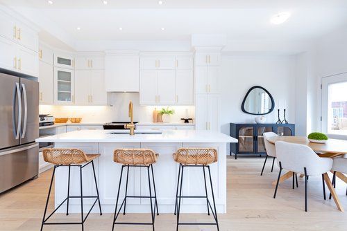 There is a large island in the middle of the kitchen.