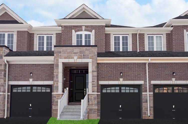 A brick house with three garages and a staircase leading to the front door.