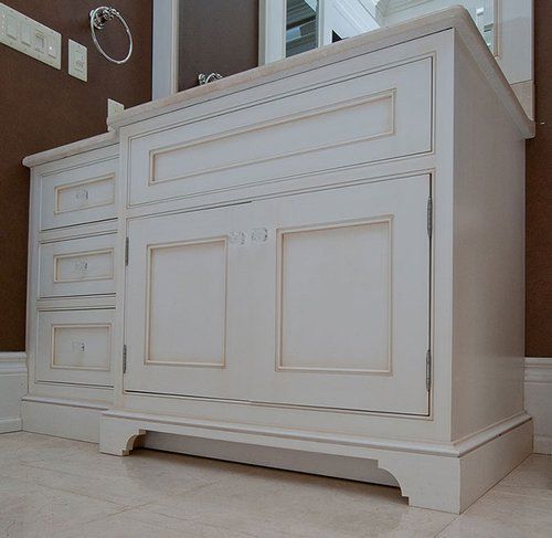 A bathroom vanity with a sink and a mirror.