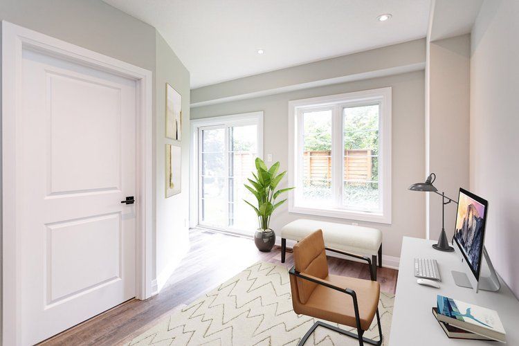 An artist 's impression of a home office with a desk , chair and computer.