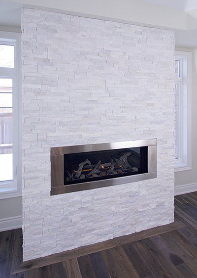 There is a fireplace in the middle of the room.