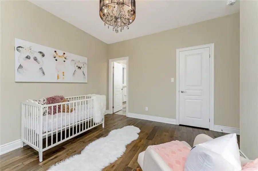 There is a crib in the middle of the room.