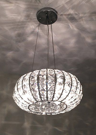 A crystal chandelier is hanging from the ceiling