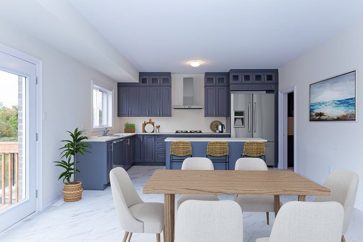 A kitchen and dining room in a house with a table and chairs.