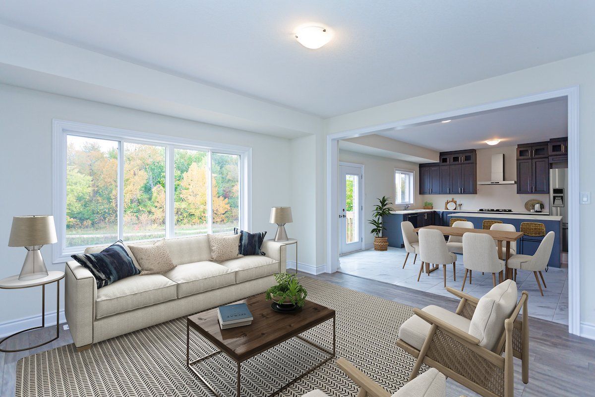 A living room with a couch , chairs , and a coffee table.
