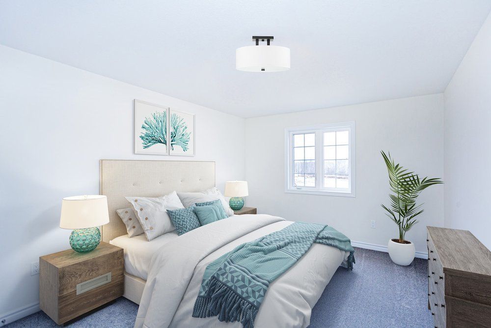 A bedroom with a bed , nightstand , dresser and window.